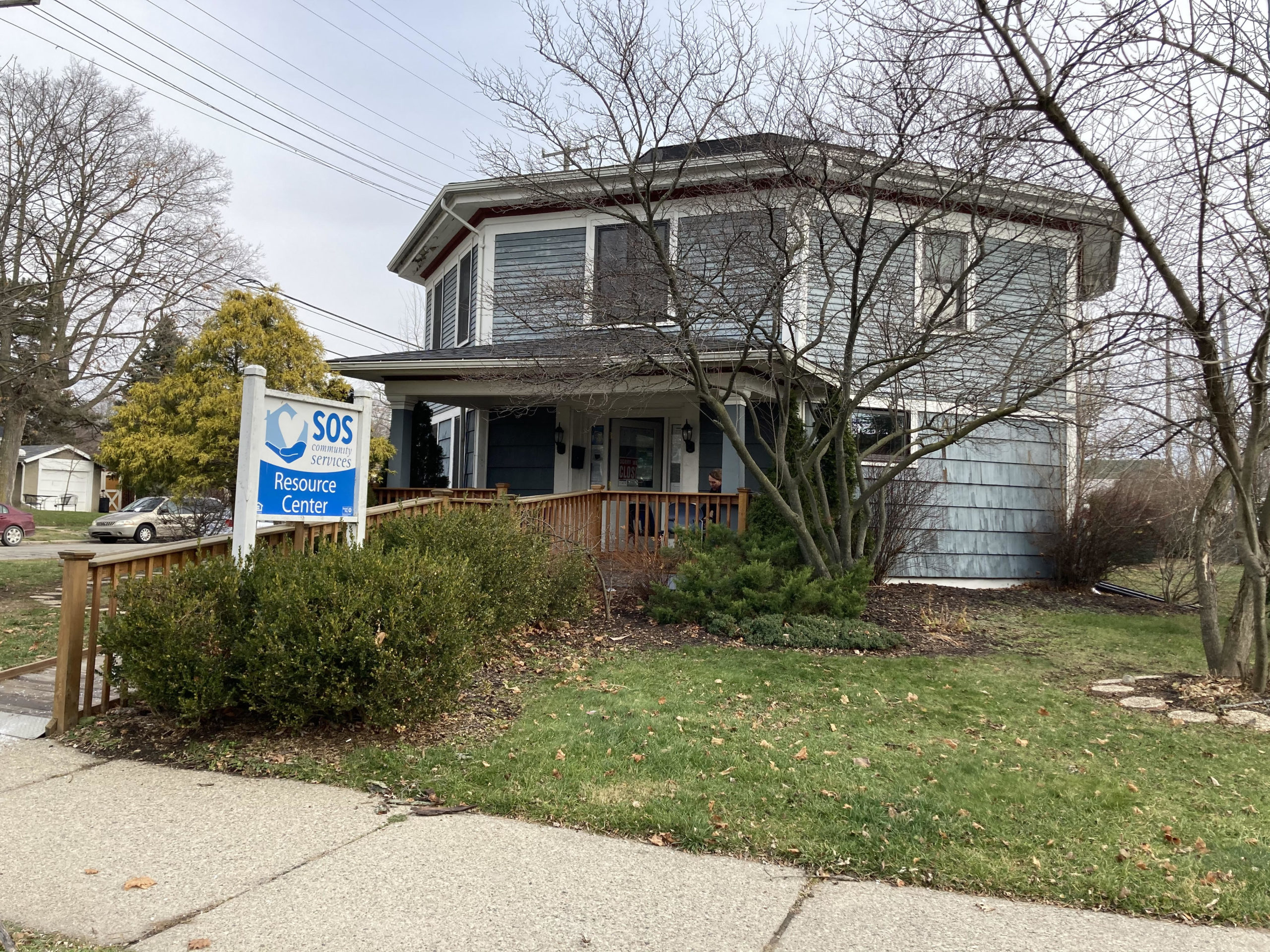 Blue House with SOS sign in front